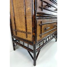 an old wooden dresser with bamboo drawers