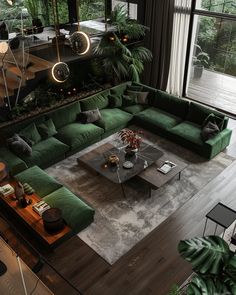 a living room filled with lots of green furniture