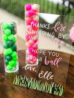 two vases filled with candy sitting on top of a table