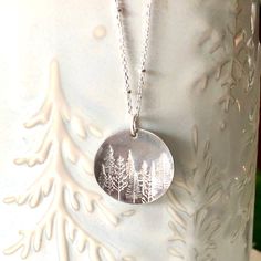 A stunning silver pine tree necklace for the nature lover! This piece is hand stamped with a lovely forest scene of our beautiful surroundings. A perfect gift to give the nature enthusiast! 🌿 Chain is a solid sterling silver satellite chain. You may choose your length at checkout. 🌿 Choose to have stars in your sky, or without. (shown in photos) 🌿 Silver disk is 2cm in diameter and made from alkeme. Please see all photo's for size reference. Alkeme is lead, nickel, and cadmium free and tarnis Forest Necklace, Stained Glass Earrings, Leather Jewelry Making, Hand Stamped Ring, Stamped Earrings, Plant Jewelry, Tree Jewelry, Nature Earrings, Stamped Bracelet