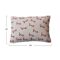 a pillow with red letters on it, and measurements for the back of the pillow