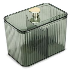 a glass container with a metal lid