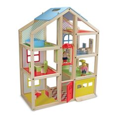 a wooden doll house with lots of furniture and accessories on the top floor for play