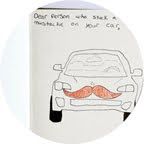 a white box with a drawing of a car and a moustache on it