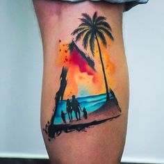 a man's leg with a watercolor painting of people walking on the beach