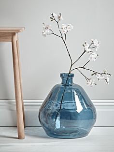 a blue vase with white flowers in it