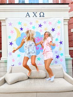 Two girls jumping on a couch in colorful pjs. Meant to be cute, fun, playful, and candid for a photo inspiration and pic ideas. Slumber Party Sorority Theme, Slumber Party Bid Day Theme, Alpha Chi Omega Recruitment, Recruitment Workshop Ideas Sorority, Work Week Ideas Sorority, Spirit Week Sorority, Sorority Spirit Week, Sorority Work Week Themes