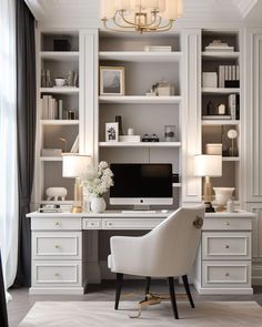 a white desk and chair in a room with built - in bookshelves on the wall