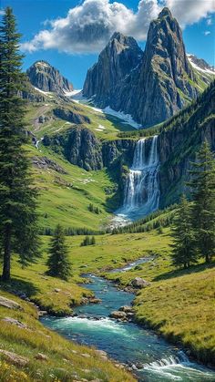 a mountain stream running through a lush green valley