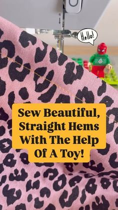 a sewing machine with the words sew beautiful, straight hems with the help of a toy