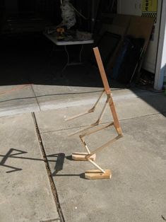 a broken umbrella sitting on top of a sidewalk