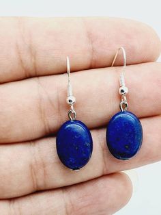 A pair of Afghanistan's Natural Lapis Lazuli Gemstone hand made oval shaped earrings with silver plated hooks.   Size.  36 mm Nickel-free Oval Beads Earrings For Gift, Blue Oval Earrings With Natural Stones, Blue Oval Cabochon Earrings As Gift, Blue Oval Cabochon Earrings For Gift, Lapis Lazuli Gemstone, Oval Earrings, Oval Earring, Lapis Lazuli, Jewelry Earrings Dangle