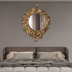 a bedroom with a large bed and mirror on the wall