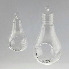 Light Bulb glass hanging terrariums can be both appealing and eco-friendly. They have flat bottoms so you can choose to hang it or sit in on a table. Fill these centerpiece glasses with plants, flowers, candles, or other objects for a stunning display that will impress your guests.Please note: Terrarium is sold bare (without plants, soil, etc.). Height: 6 inch, Width: 3 inch, Open: 1-3/4 inchHeight: 7 inch, Width: 3-1/2 inch, Open: 1-3/4 inchHeight: 8 inch, Width: 4-1/2 inch, Open: 2-1/2 inch Light Bulb Terrarium, Terrarium Candle Holder, Hanging Candle, Flowers Candles, Hanging Terrarium, Round Candles, Glass Terrarium, Candle Vase, Vase Candle Holder