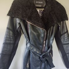 Designer Guess Coat Nwt: N E W - Condition B L A C K L E A T H E R L U X E... ~ Black-Color, Leather-Feel ~ L U X U R Y - Contemporary S T Y L E D ^ Highly-Detailed Metal Trim + Zipper ^ Gold-Metal Hardware + Guess Print Lining + Pattern-Rich Lace & Floral Oversized Collar In Sherpa Adds Sporty-Chic Style = Coordinate Belt Is Stunning! = Well-Made Belt & Garment Size: S Dimensions: Arm P 17" (Zipped) Length 27" Approx G U E S S + S P O R T Y - C H I C Fitted Black Biker Jacket With Faux Fur Trim, Fitted Leather Jacket With Faux Fur Trim For Work, Black Biker Jacket With Faux Fur Lining For Work, Lining Pattern, Coat Belt, Sporty Chic Style, Oversized Collar, Winter Chic, Collar Coat