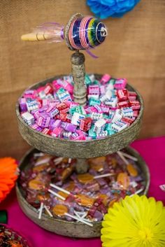 there is candy on top of the cake plate and it's being thrown into the air