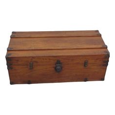 an old wooden box with two latches on it