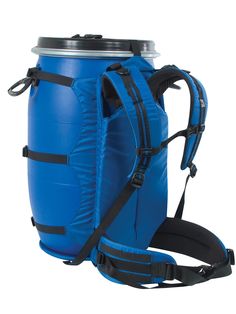 a large blue backpack sitting next to a water bottle