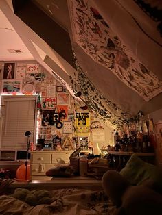 the ceiling is covered with posters and pictures