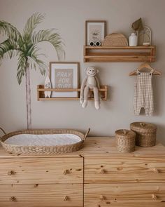 a baby's room with wooden furniture and decor