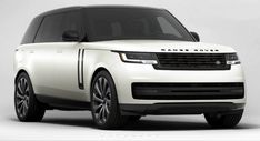 the white range rover is parked in front of a gray background