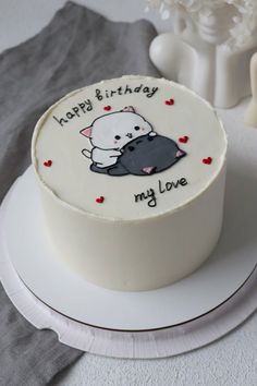 a birthday cake with a cat on it