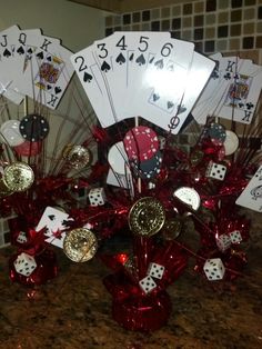 a table topped with lots of cards and dices on top of a marble counter