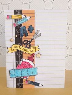 a handmade card with scissors, pencils and tape