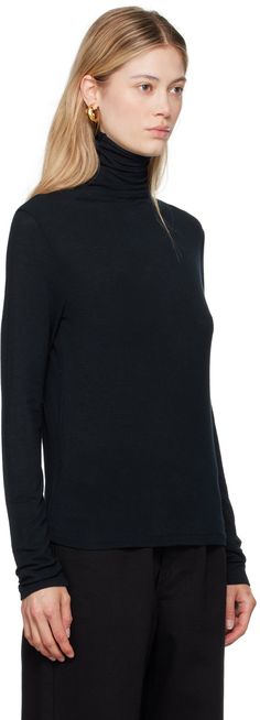 Semi-sheer stretch viscose- and wool-blend jersey turtleneck. Raw edge at collar. Supplier color: Navy Fine Knit Turtleneck For Workwear, Elegant Mock Neck Top For Layering, Stretch Fine Knit Turtleneck For Work, Sheer Turtleneck, Jersey Turtleneck, Raw Edge, Wool Blend, Women Wear, Turtle Neck