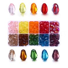 various colors of glass beads in a plastic container with labels for each bead size