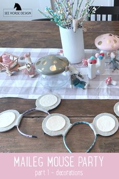 the table is set up for a party with plates and decorations on it, along with other items