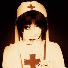 a woman in a nun outfit with a cross on her shirt