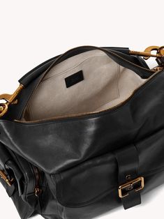 Chloé's Large Camera bag is crafted from natural shiny buffalo leather. Its multiple pockets are embellished with revamped buckles from the iconic Paddington bag. Carry the Camera bag in the hand, on the shoulder or cross-body with the handles or strap. Product Details Designer ID: CHC24AS532N83001 Color: Black Composition: Main material: Buffalo leather; Flap lining: Buffalo leather; Main lining: 54% Cotton, 46% Linen Width: 16.9" (43 cm); Height: 7.9" (20 cm); Depth: 8.3" (21 cm); Handle drop: Loafer Sneakers, Loafer Mules, Buffalo Leather, Dark Khaki, 16 9, Mini Bag, Camera Bag, Cross Body, Heeled Boots