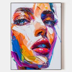 a painting of a woman's face with bright colors