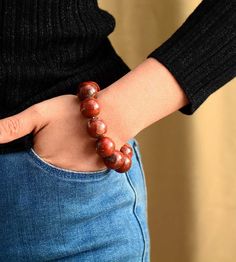 Make a Statement with Our Red Jasper Bracelet Elevate your style with our unique and offbeat Red Jasper Bracelet, a captivating stone bracelet that goes beyond conventional accessories. Handcrafted with care, this bracelet showcases the rich beauty of Red Creek Jasper in a comfortable stretch band. Balancing Energies: Red Creek Jasper is more than a gem; it's a harmonizing force. Believed by many to bring balance and relaxation, this bracelet is designed to complement your energetic flow. Like o Red Jasper Bracelet, Jasper Bead Bracelet, Red Creek Jasper, Red Jasper Stone, Jasper Bracelet, Stretch Band, 7 Chakras, Christmas Gift Jewelry, Elastic Bracelet