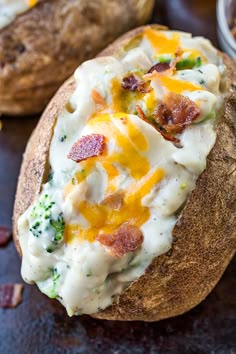 a baked potato with cheese and bacon on it