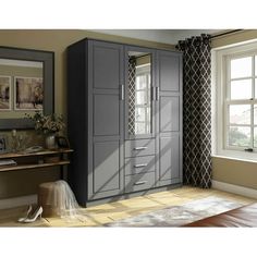 a room with two large gray cabinets next to a window