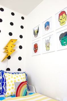 a child's bedroom with black and white polka dots on the wall