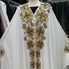 Luxurious Abaya Dress. Superior Quality. Limites Edition. Satisfied Or Reimbursed White Floor-length Abaya, White Kaftan For Eid Party, White Floor-length Kaftan For Party, Elegant Long White Abaya, Elegant White Long Sleeve Abaya, Traditional White Floor-length Abaya, White Long Abaya For Party, White Embellished Long Dresses, White Floor-length Abaya For Eid