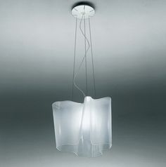 a modern light fixture hanging from the ceiling