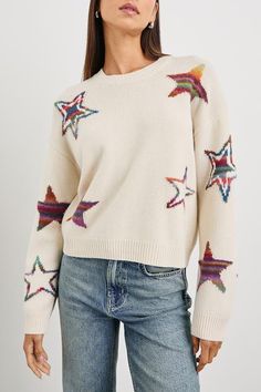 The Perci Sweater is an easy knit made of a wool blend. It's detailed with multi colored stars against an ivory base and features include a dropped shoulder, relaxed fit, and thick ribbed trim at the cuffs and hem.    Relaxed fit    37% Acrylic  33% Nylon  30% Wool    Dry clean. Cool iron if needed. Do not bleach. Denim Sweater Jacket, Easy Knit, Fall Denim, Rainbow Star, Denim T Shirt, Denim Sweater, Star Sweater, Denim Accessories, Weekend Wear