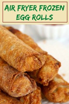 fried egg rolls stacked on top of each other with text overlay reading air fryer frozen egg rolls