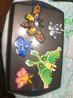 a black tray with some stickers on it