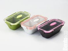 three different colored containers with lids on them