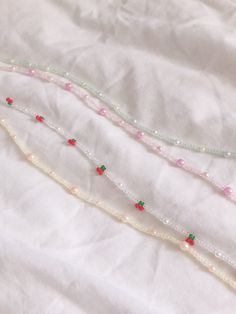 "necklaces are 14\" - 16\" bracelets are 6\" but elastic so can comfortably stretch to 8\" anklets are 9\" - 11\" These seed beaded strands with pearls are perfect to accessorize with any outfit! In styles, green, pink, yellow, and cherry, these minimal and colorful pieces will add the perfect pop onto any outfit. Get these as a gift for a friend, partner, or yourself! Please message me with any questions or personalization requests for length." Seed Bead Tutorials, Cherry Necklace, Beaded Jewelry Necklaces, Beaded Bracelets Tutorial, Beading Jewelery, Beaded Jewlery, Mask Chain, Pola Gelang, Beaded Necklace Diy