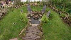 an aerial view of a garden with stone steps leading to a pond