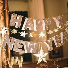 a happy new year banner hanging from a mirror