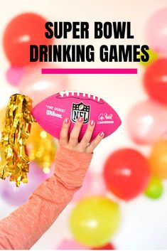 a girl holding a pink football with the words super bowl drinking games above her head