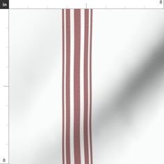 a white and red striped fabric on a ruler