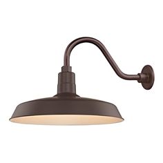 a wall light with an arm and a white light on it's side, against a